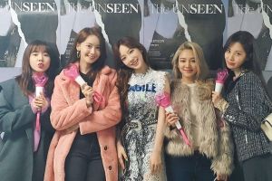 Les membres de la génération des filles encouragent Taeyeon lors de leur concert